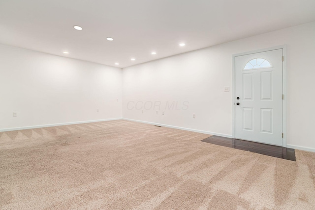 interior space featuring recessed lighting and baseboards