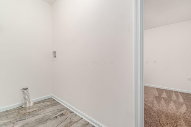 laundry room featuring laundry area, washer hookup, and baseboards
