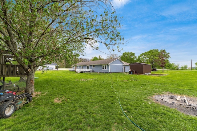 view of yard featuring an outdoor structure and a storage unit