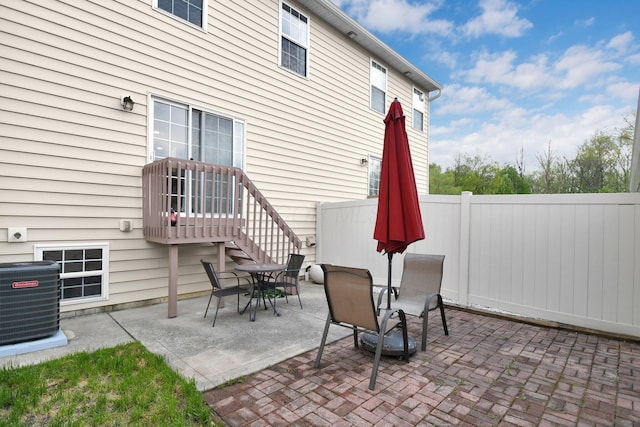 view of patio / terrace with fence and central AC unit