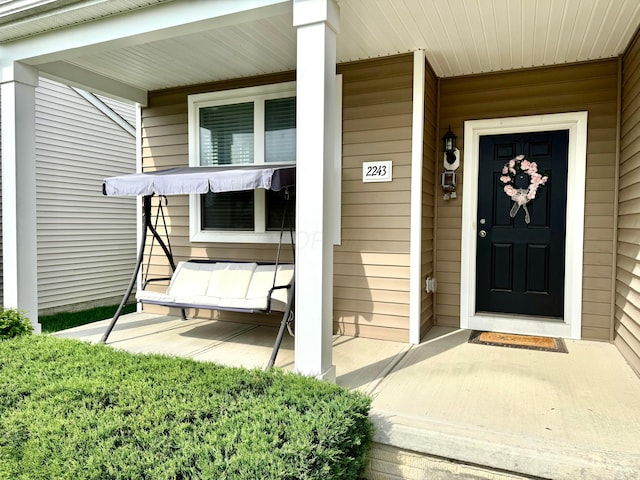 entrance to property with covered porch