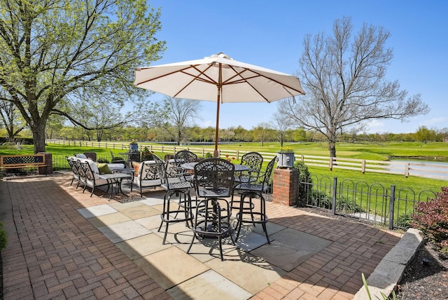 view of patio / terrace featuring outdoor dining area and fence