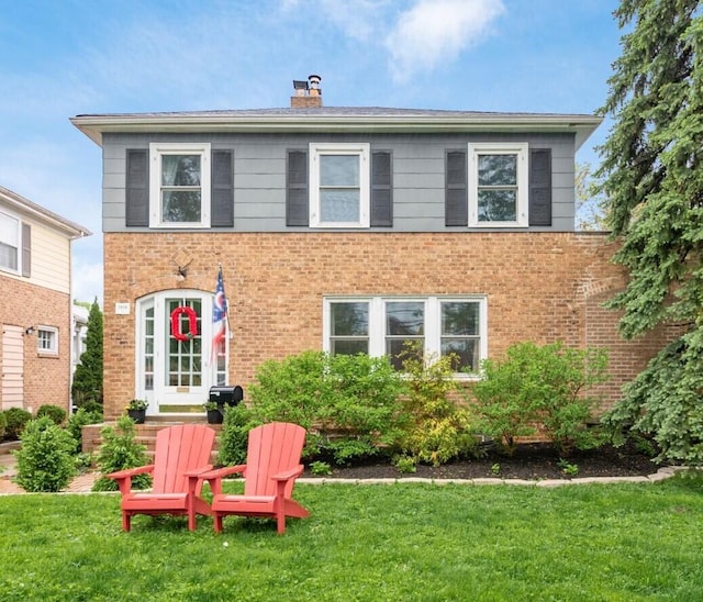 1938 W 5th Ave, Columbus, OH 43212 - rear view of property featuring brick siding, a yard, and a chimney