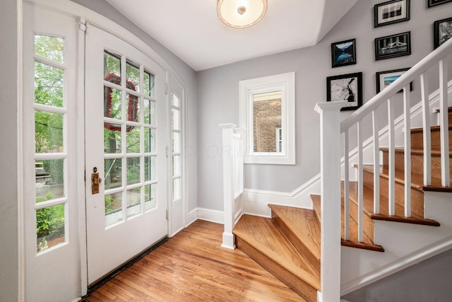 1938 W 5th Ave, Columbus, OH 43212 - foyer featuring light wood finished floors, stairway, baseboards, and lofted ceiling