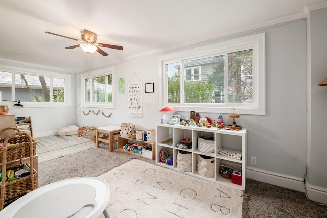 1938 W 5th Ave, Columbus, OH 43212 - playroom with crown molding, carpet flooring, ceiling fan, and baseboards