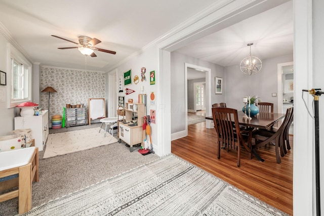 1938 W 5th Ave, Columbus, OH 43212 - dining space with healthy amount of natural light, a chandelier, ceiling fan, ornamental molding, and baseboards