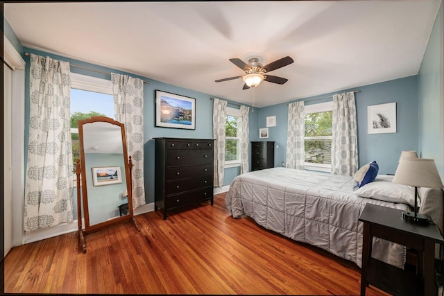 1938 W 5th Ave, Columbus, OH 43212 - bedroom with wood finished floors, baseboards, and ceiling fan