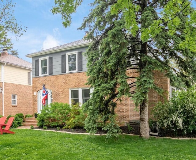 1938 W 5th Ave, Columbus, OH 43212 - view of front of house featuring a front yard and brick siding
