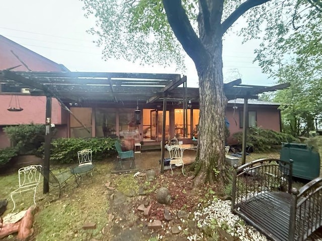back of house featuring a patio area and a pergola
