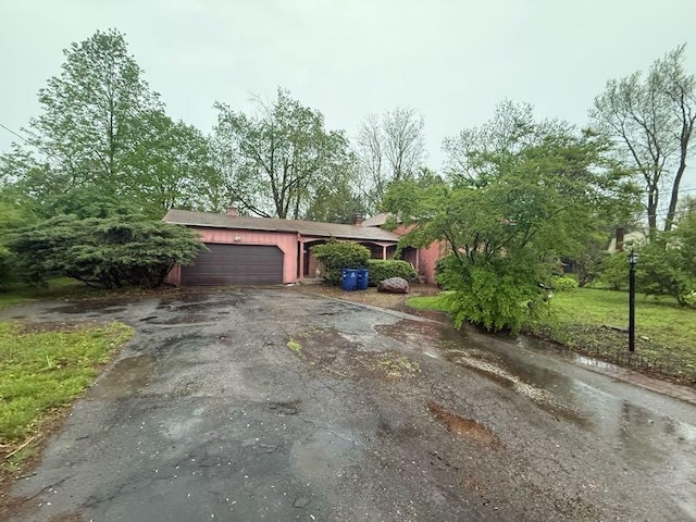 exterior space featuring a garage and driveway