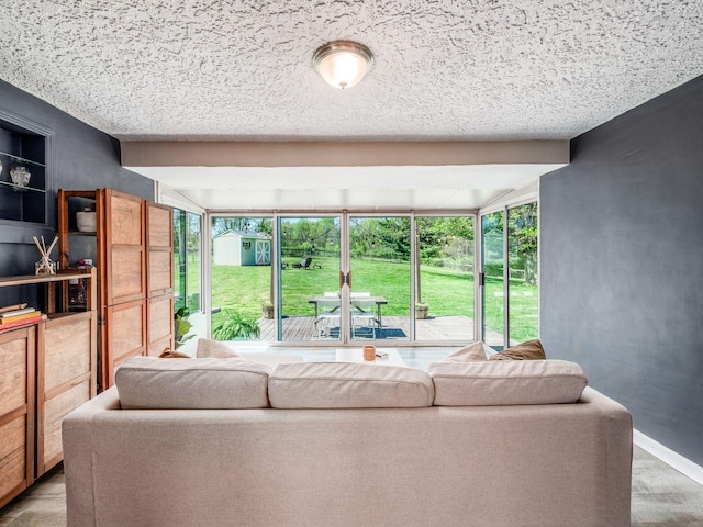 living room with baseboards and a wealth of natural light