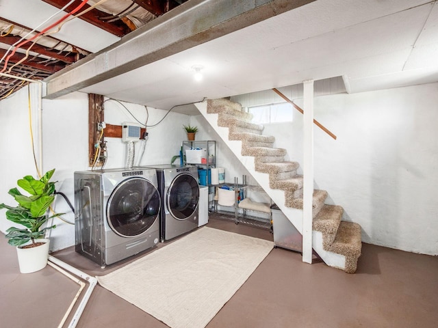 laundry room featuring separate washer and dryer and laundry area