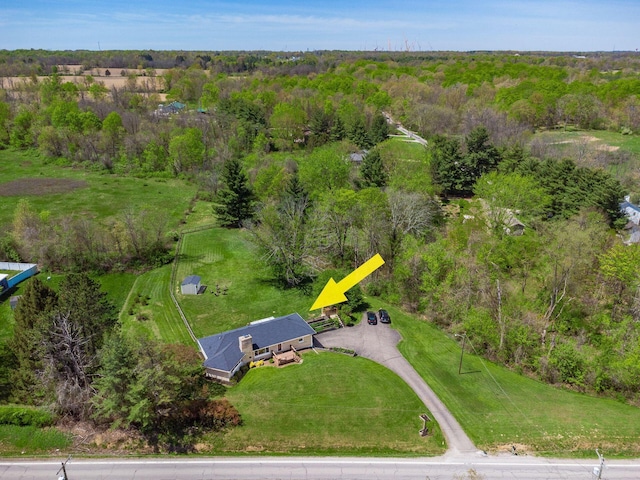 aerial view featuring a wooded view