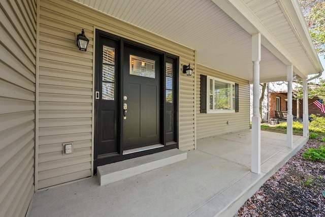 entrance to property with covered porch