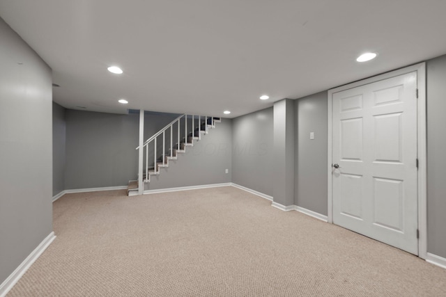 finished below grade area featuring carpet floors, baseboards, and recessed lighting