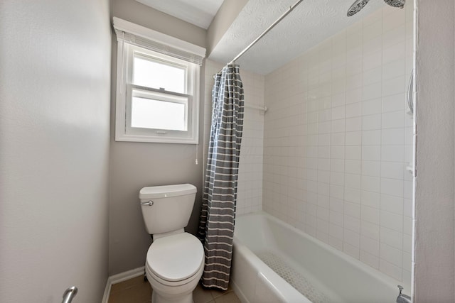 bathroom with tile patterned floors, baseboards, toilet, and shower / bath combination with curtain