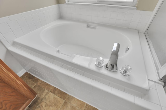 bathroom with a garden tub
