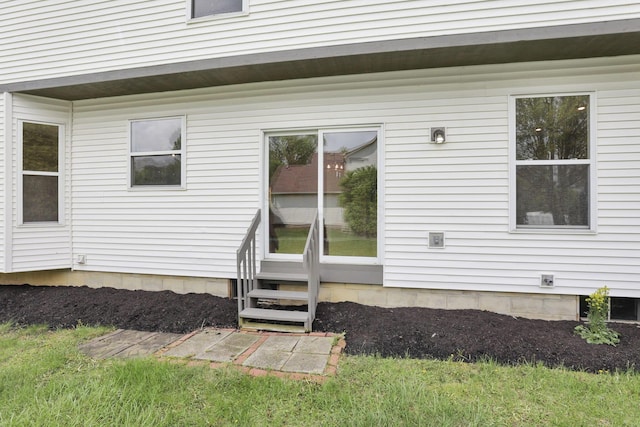 rear view of property with entry steps