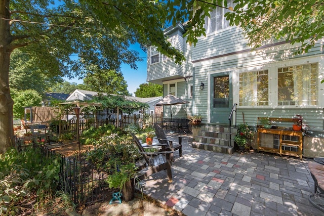 view of patio / terrace with fence and entry steps