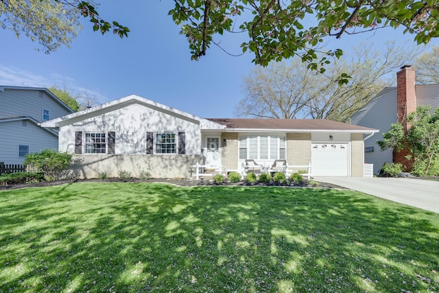 single story home featuring a garage, concrete driveway, a front lawn, and brick siding