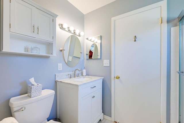 full bathroom featuring vanity, an enclosed shower, and toilet