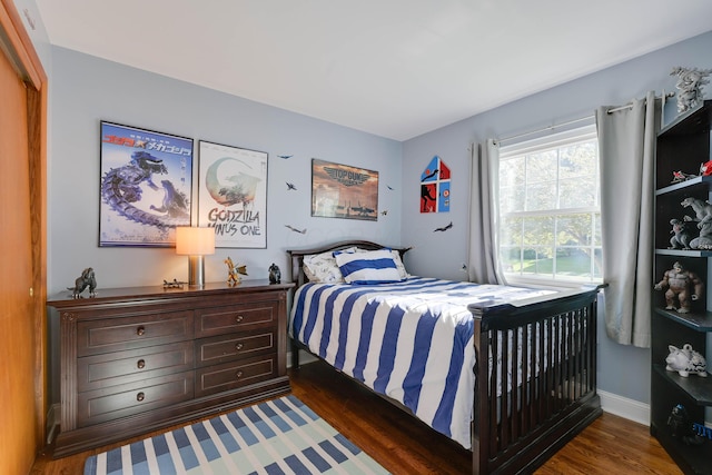 bedroom with wood finished floors