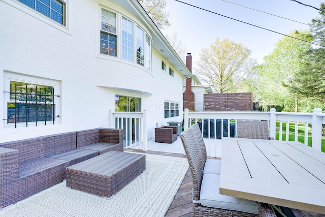 wooden terrace featuring central AC and an outdoor hangout area