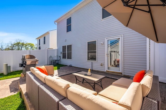 back of property featuring a patio, fence, and an outdoor hangout area