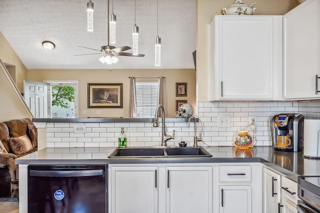 kitchen with white cabinets, a sink, a ceiling fan, tasteful backsplash, and dishwashing machine