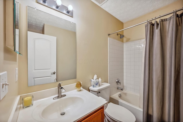 full bathroom featuring toilet, a textured ceiling, shower / tub combo, and vanity