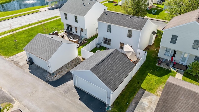 bird's eye view featuring a residential view and a water view
