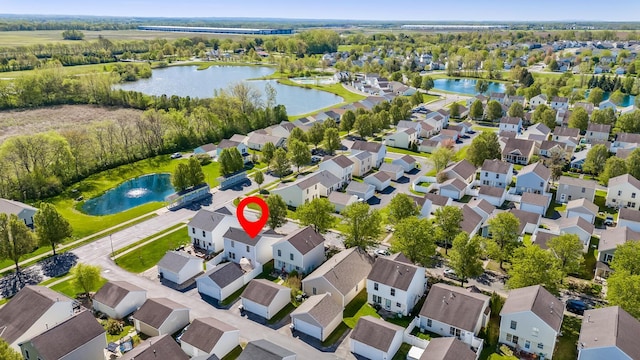 aerial view featuring a residential view and a water view
