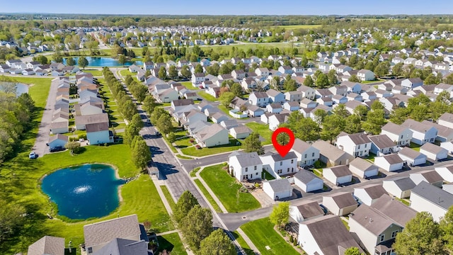 bird's eye view featuring a water view and a residential view
