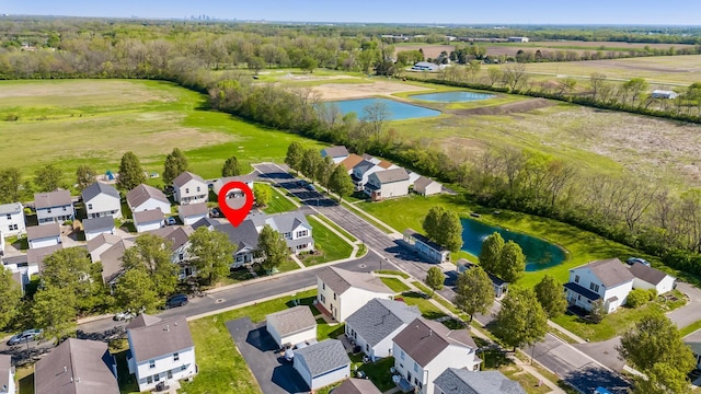 aerial view featuring a water view and a residential view