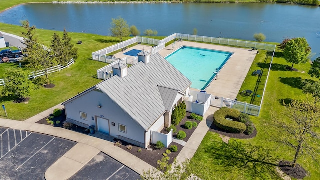 birds eye view of property with a water view