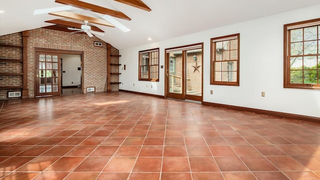 unfurnished living room featuring visible vents, ceiling fan, and tile patterned floors