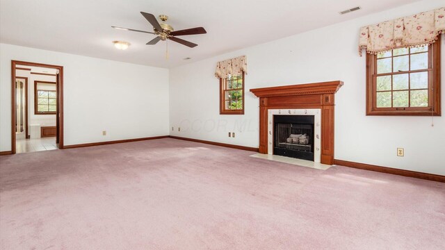 unfurnished living room featuring carpet flooring, baseboards, and visible vents