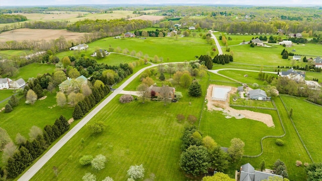 birds eye view of property with a rural view