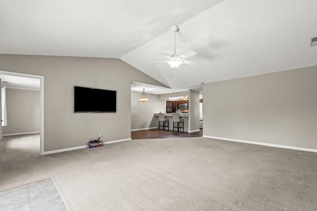 867 Red Oak Trl, Mansfield, OH 44904 - unfurnished living room featuring ceiling fan, visible vents, baseboards, lofted ceiling, and carpet