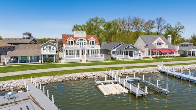 3555 Sellers Dr NE, Millersport, OH 43046 - rear view of house with a water view, boat lift, and a yard