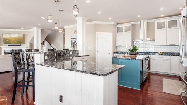 3555 Sellers Dr NE, Millersport, OH 43046 - kitchen with wall chimney range hood, open floor plan, dark wood-style flooring, ornamental molding, and a center island