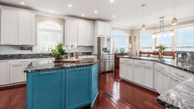 3555 Sellers Dr NE, Millersport, OH 43046 - kitchen featuring stainless steel fridge, ornamental molding, healthy amount of natural light, a sink, and white cabinetry