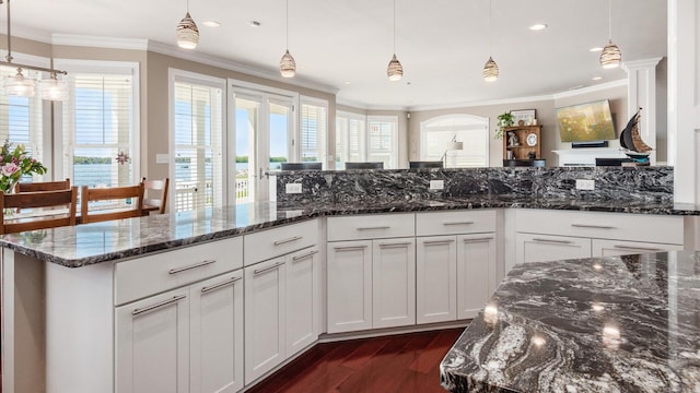 3555 Sellers Dr NE, Millersport, OH 43046 - kitchen featuring dark wood-style flooring, ornamental molding, healthy amount of natural light, white cabinets, and recessed lighting