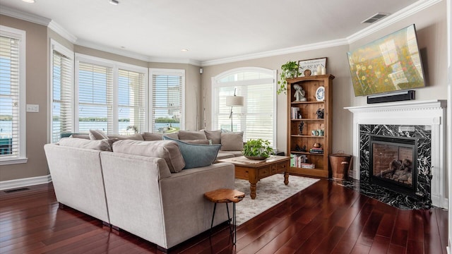 3555 Sellers Dr NE, Millersport, OH 43046 - living room with dark wood finished floors, crown molding, a premium fireplace, baseboards, and recessed lighting