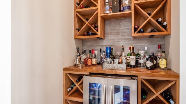 3555 Sellers Dr NE, Millersport, OH 43046 - indoor dry bar featuring wine cooler and tasteful backsplash