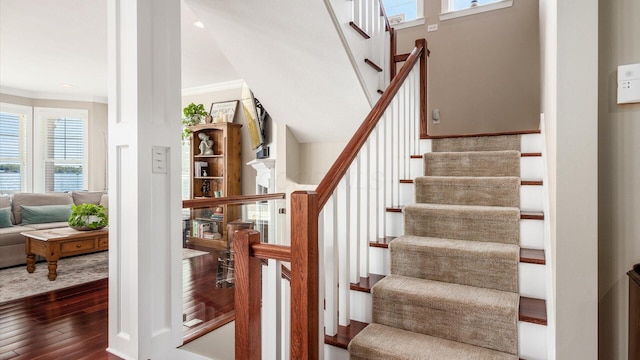 3555 Sellers Dr NE, Millersport, OH 43046 - stairs with wood-type flooring, crown molding, and plenty of natural light