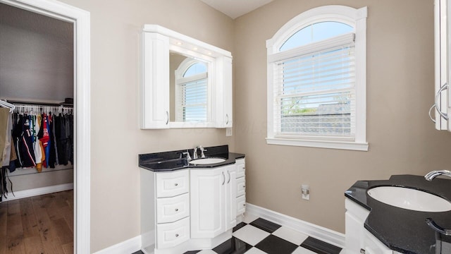 3555 Sellers Dr NE, Millersport, OH 43046 - full bathroom with vanity, baseboards, and a spacious closet