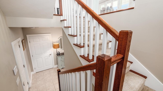 3555 Sellers Dr NE, Millersport, OH 43046 - staircase featuring baseboards and tile patterned flooring