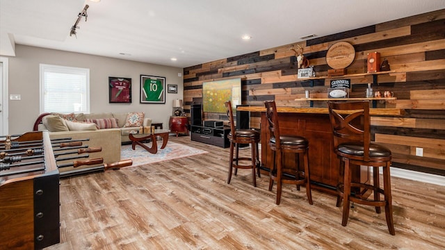 3555 Sellers Dr NE, Millersport, OH 43046 - indoor dry bar featuring wooden walls, wood finished floors, and rail lighting