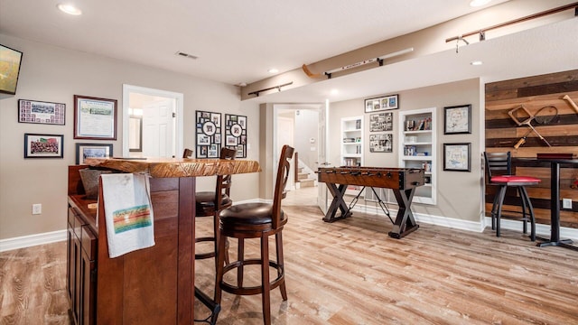 3555 Sellers Dr NE, Millersport, OH 43046 - indoor bar featuring light wood-style flooring, baseboards, recessed lighting, and built in shelves